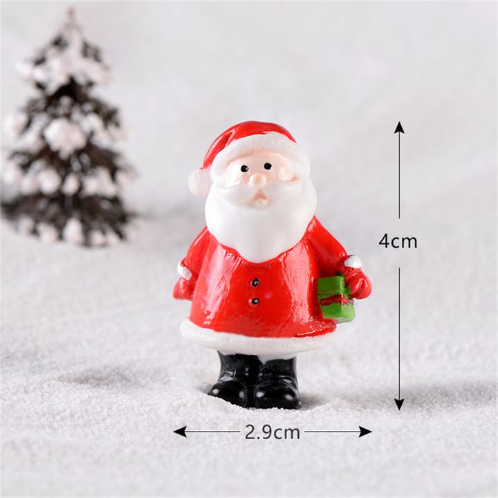 Folk Art Christmas Village Figurines, Santa with green gift