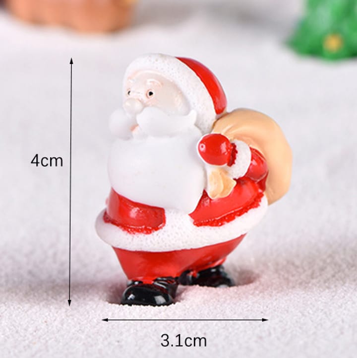 Folk Art Christmas Village Figurines, Santa carrying tan sack